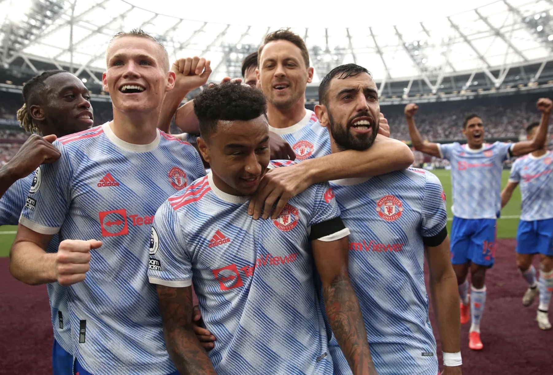 Jesse Lingard mobbed by team mates after scoring the winner