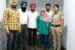 Joy Chika Ozuma in veil with Punjab police officials