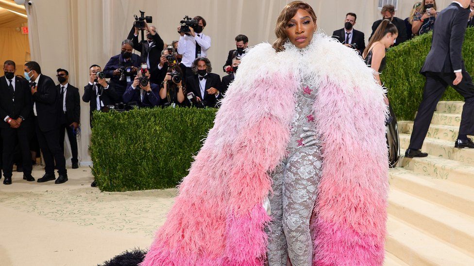 Serena Williams grabbed attention in a Gucci bodysuit beneath a floor-length feather cape