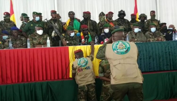 The Guinean coup leaders at a meeting with ousted politicians on Monday