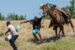 A United States Border Patrol agent on horseback tries to stop a Haitian migrant from entering an encampment. AFP Photo