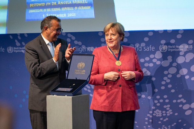 WHO chief Tedros and Angela Merkel in Berlin on Wednesday