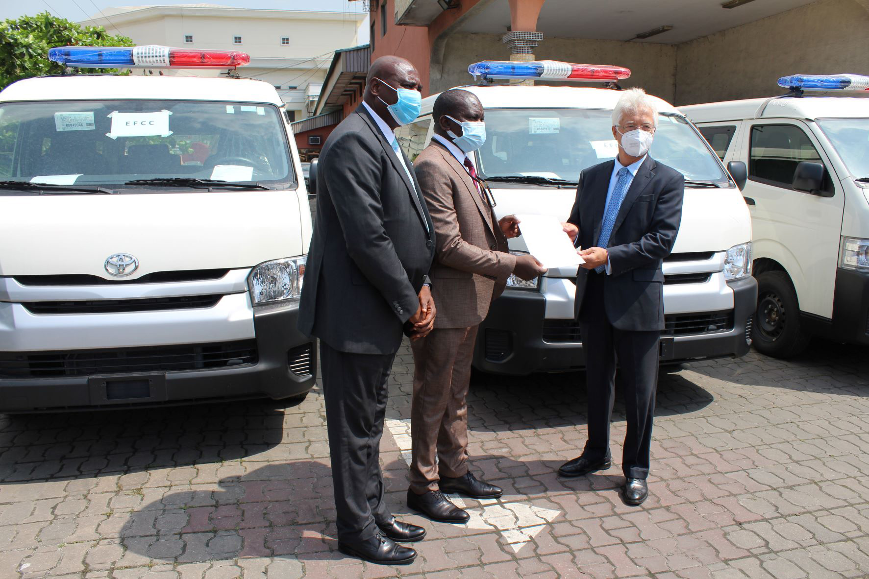 Officials of the Economic and Financial Crimes Commission receiving the donated vehicles from the Consul General of the Federal Republic of Germany in Lagos, Dr. Bernd von Munchow-Poh in Lagos