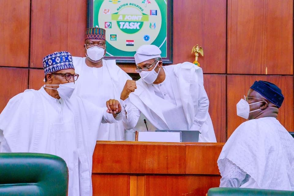 Buhari exchanging greeting with Femi Gbajabiamila