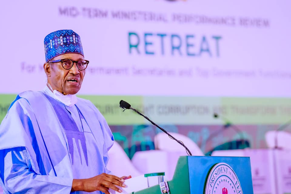 Buhari addressing ministers and others at the retreat