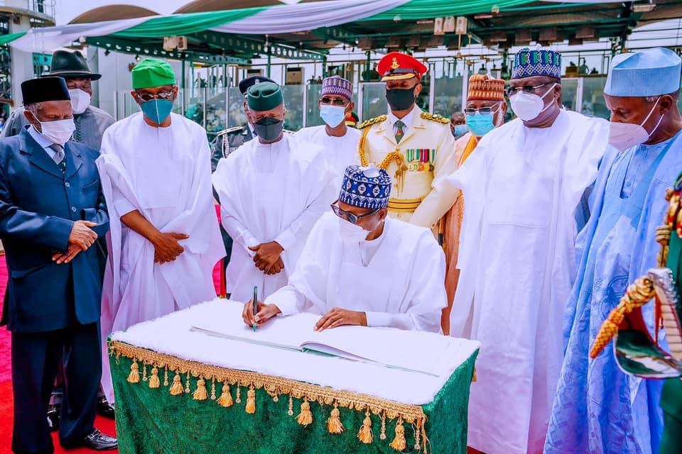 Buhari signing the anniversary register
