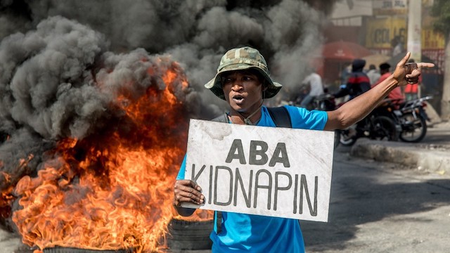 A man protests the latest kidnapping in Port au Prince on Saturday. Photo Haitian Times
