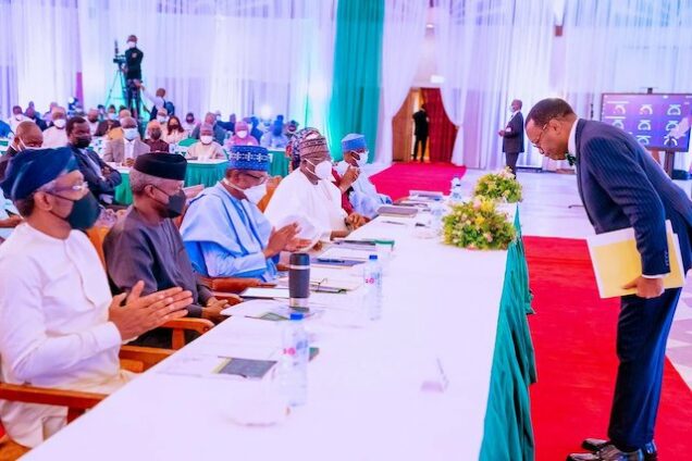 AfDB boss Adesina bowing to Buhari at the retreat for ministers in Abuja