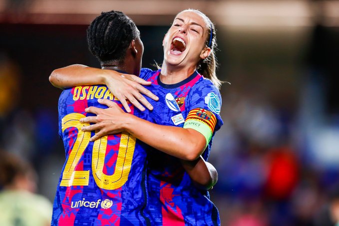 Asisat Oshoala hugs teammate