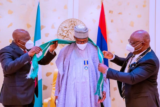 Buhari being honoured by Chartered Insurance Institute of Nigeria (CIIN) with Grand Patron award