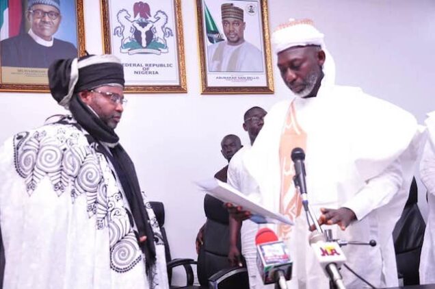 Commissioner for Local Govt  Emmanuel Umar presents appointment letter to Mohammed Barau emir of Kontagora