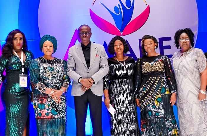  L-R: Winner of brand new Sport Utility Vehicle, Mrs. Adetoro Ojora-Akintola; Wife of Lagos State Deputy Governor, Mrs Oluremi Hamzat; the State Governor, Mr Babajide Sanwo-Olu; winner of 3-bedroom apartment star prize, Mrs. Olasunbo Bankole; First Lady and Chairman, Committee of Wives of Lagos State Officials (COWLSO), Dr. Ibijoke Sanwo-Olu; and winner of return ticket to London, Mrs. Amodu Mary-Ann Adetoro, during the Gala Night of the 21st National Women’s Conference of COWLSO, held at Eko Hotels and Suites, Victoria Island, Lagos, on Wednesday, October 27, 2021. 