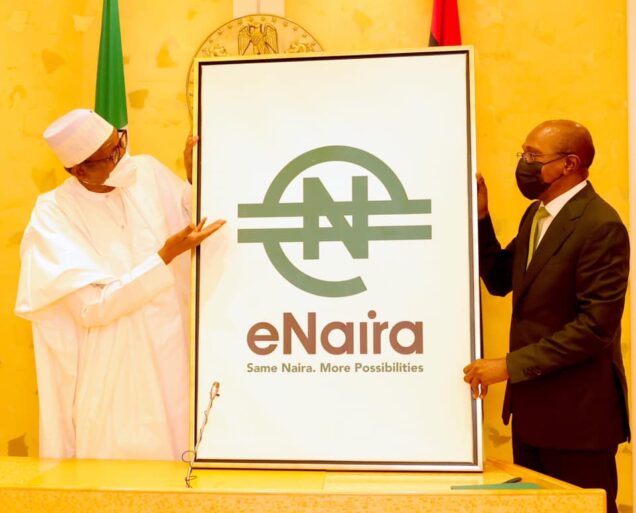 President Muhammadu Buhari and CBN Governor Godwin Emefiele launching the eNaira at Aso Rock presidential villa, Abuja on Monday:  Buhari assures that eNaira and its underlying technology, block chain is safe  can increase Nigeria’s GDP by $29bn in10 years.