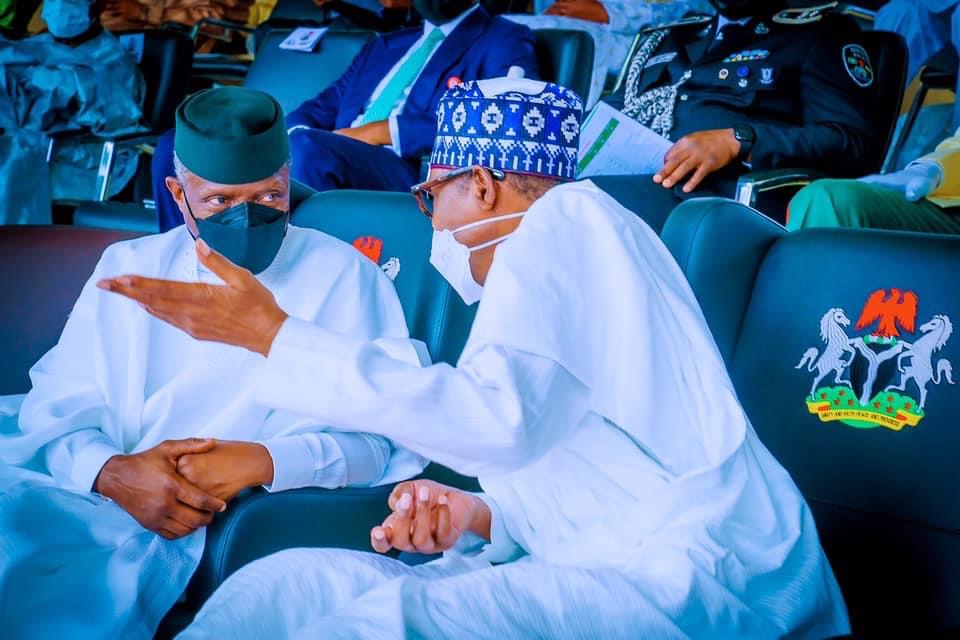 Buhari with Vice President Yemi Osinbajo at the event
