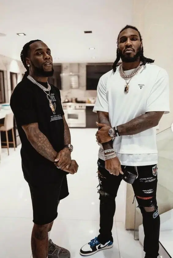 Nigeria's Burna Boy strikes a pose with American basketball player, Corey Jae Crowder. 