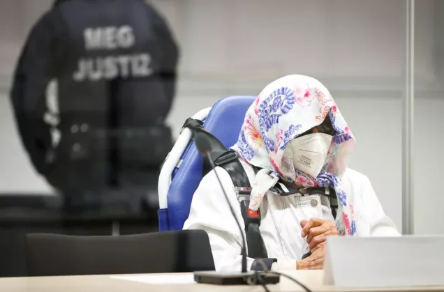 Irmgard Furchner, a 96-year-old former secretary to the SS commander of the Stutthof concentration camp, is pictured at the beginning of her trial in a courtroom, in Itzehoe, Germany, Oct. 19, 2021. Christian Charisius/Pool via REUTERS.