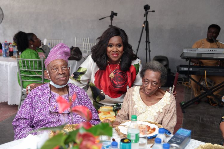 Mr Femi Bucknor, Mrs Remi Bucknor with the celebrant