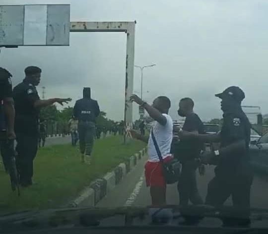 Okanlawon showing his identity card to police