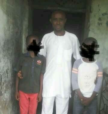 Prince Wiro, National Coordinator of Centre For Basic Rights And Accountability Campaign with two out of the four children allegedly harassed sexually by suspected homosexual, Ekpeye