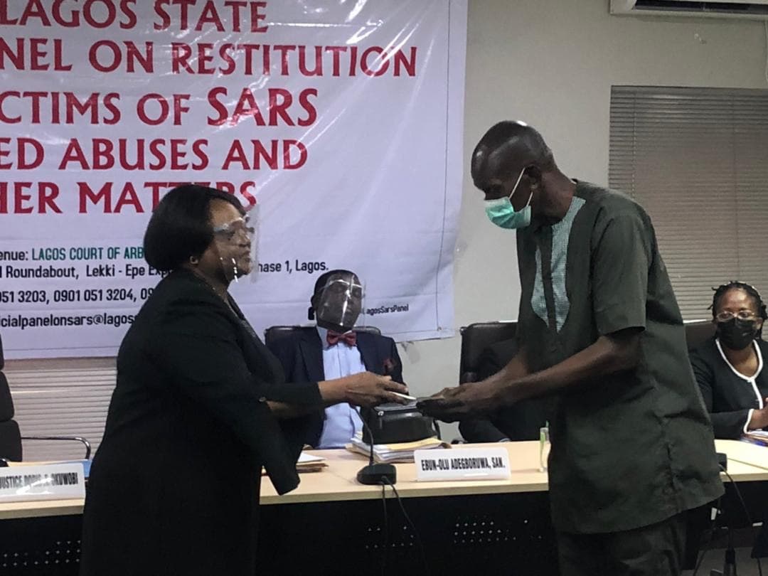 One of the petitioners receiving compensation at the judicial panel