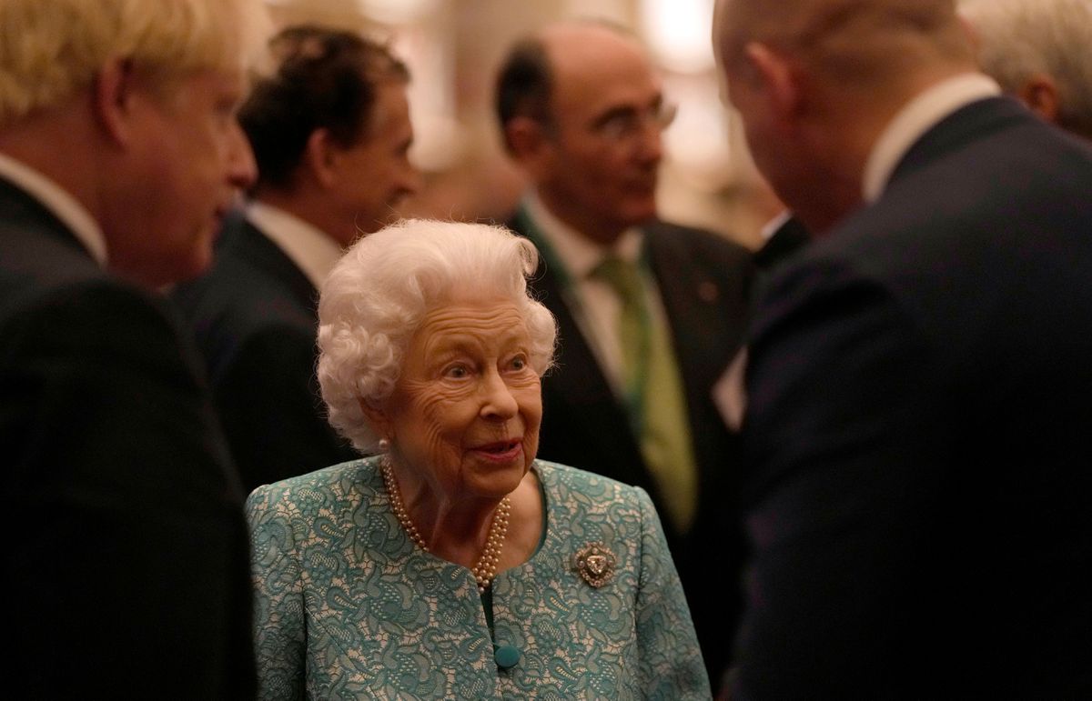 Britain’s Queen Elizabeth and Prime Minister Boris Johnson greet guests at a reception for the Global Investment Summit in Windsor Castle, Windsor, Britain, October 19, 2021. Alastair Grant/Pool via REUTERS.