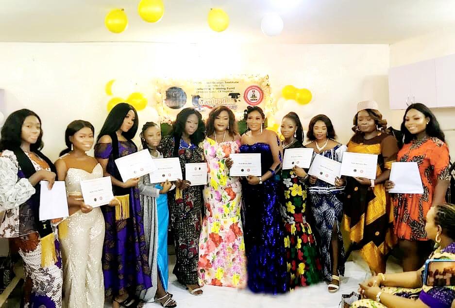 Graduate trainees displaying their certificates at the just concluded skills acquisition programme organized by Cilla Meduna Design Institute in conjunction with the Industrial Training Fund(ITF).