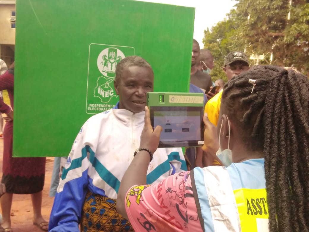 An INEC official taking the capturing a voter