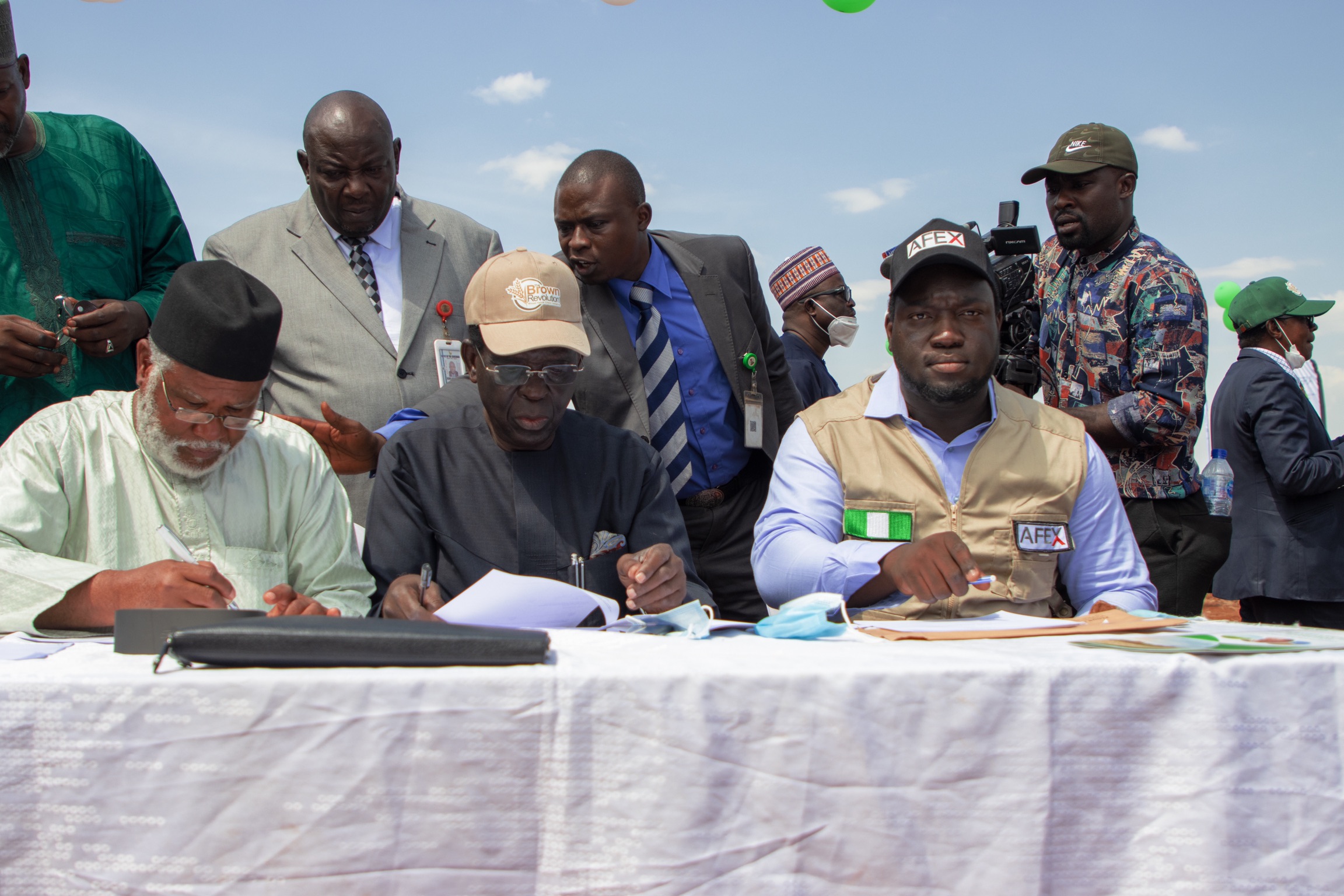 AFEX CEO Ayodeji Balogun, National President Wheat Farmers Association of Nigeria (WFAN), Salim Saleh Mohammed, and Olusegun Falade, General Manager, Flour Mills of Nigeria at the signing of the MoU on Tuesday.