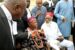Ezeife and an Igbo monarch sit outside the court premises