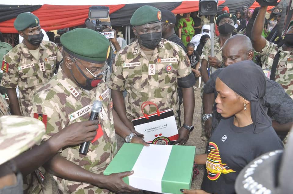Faruk Yahaya presents Nigerian flag to families of Zurkushu and the other late soldiers