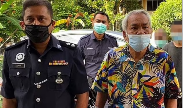 The suspect, Hasan after his arrest by police.