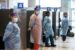 Health workers at an airport in Canada waiting to test for Omicron variant