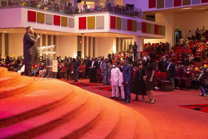 Pastor Mike Okonkwo while praying for the family of the deceased at the night of tributes held in Lagos