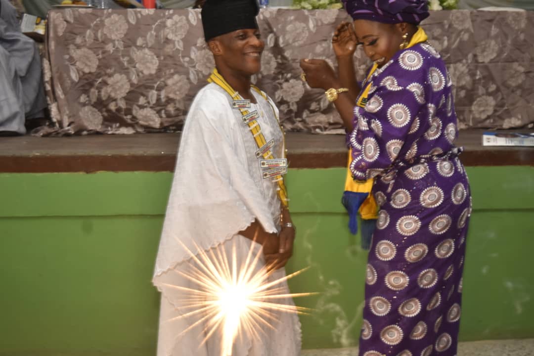 Newly installed president of the club, Lion Sina Agbeluyi (M) and the Immediate Past President, Lion Agnes Aremo during the decoration with the insignia of authority.