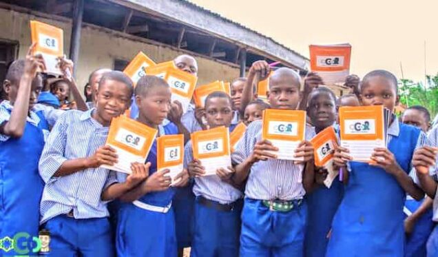 Students display books donated by Osinbajo Grassroots Organisation, OGO,