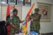The outgoing Brigade Commander, Brigadier General Adewale Adekoya presenting flag to the newly appointed Brigade Commander ,rigadier General Abdullahi.