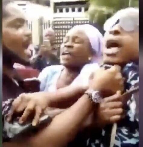 A policeman being manhandled in Lagos