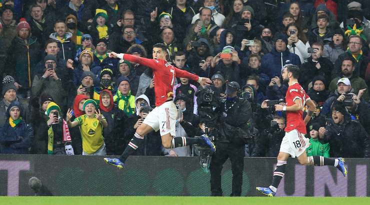 Norwich, UK. 11th Dec, 2021. Cristiano Ronaldo of Manchester United scores  the only goal of the game from the penalty spot during the Premier League  match between Norwich City and Manchester United