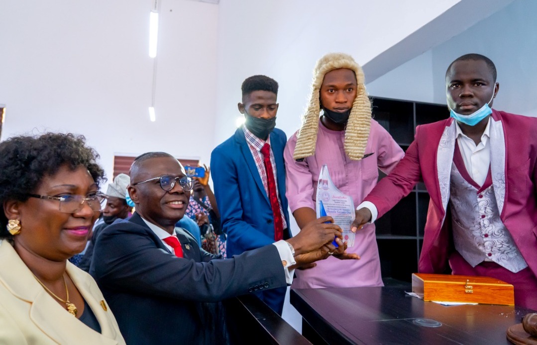 L-R: Vice Chancellor of Lagos State University (LASU), Professor Ibiyemi Olatunji-Bello, watches as Lagos State Governor, Mr. Babajide Sanwo-Olu receives a plaque from the Speaker of the Students Union Representatives, Rt. Hon. Mustapha Adejuwon and President of the Student Union Government, Comrade Oladipupo Uthman Badmus, during the commissioning of the new Student Union Arcade at LASU, Ojo, on Thursday