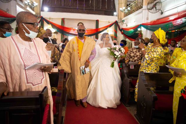 The Bride Ademide Oyewo and her dad Captain Funso Oyewo makes a grand entrance at the church
