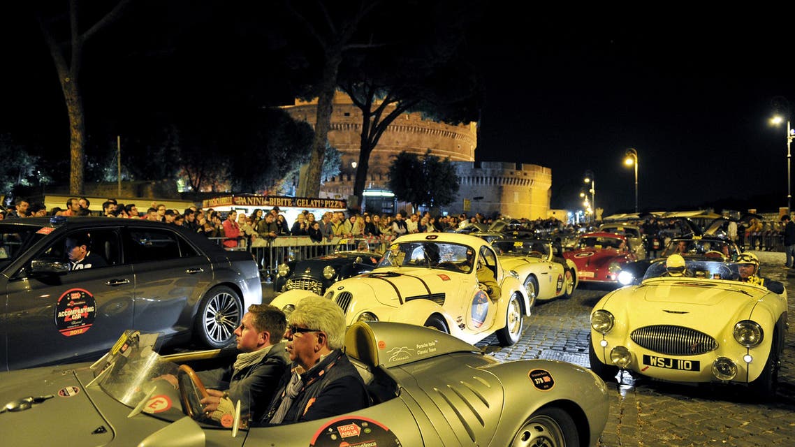 Vintage cars in a parade at Castel Sant'Angelo during Mille Miglia race arrival in Rome on May 18, 2012