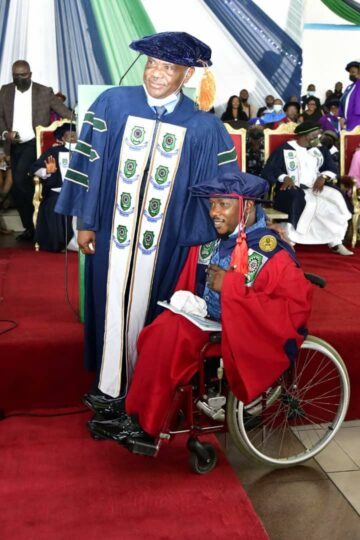 Governor Nyesom Ezenwo Wike of Rivers State (left) and James E. Daniel (right), who was rewarded with N50 Million and automatic lectureship appointment in Rivers State University by the governor for bagging a Doctor of Philosophy (PhD) degree