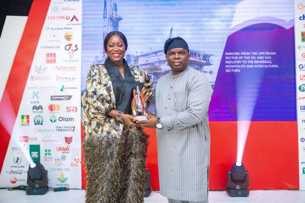 Mrs. Solate Ovundah-Akarolo, Deputy Managing Director, Moni Pulo Petroleum Development Limited, receiving the Outstanding Business Woman Award from Dr. Ogho Okiti, Managing Director, Businessday Media limited on behalf of Dr. Mrs. Seinye O. B. Lulu-Briggs, the Chairman and CEO, Moni Pulo Petroleum Development Limited.