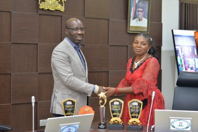 Governor Godwin Obaseki and the outstanding Edo Biology teacher in the state,Mrs. Benedicta Idele who got a house and a cash sum of N1 million for her feat