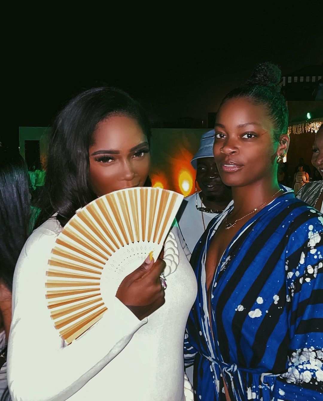 Tiwa Savage with a fan in Accra, Ghana