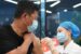 A chinese man receives COVID-19 vaccine jab