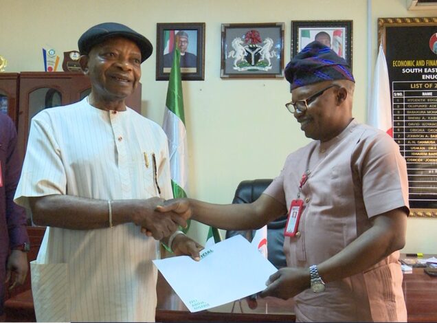 The Zonal Commander, Mr. Oshodi Johnson handing over the documents of the houses to Prince Arthur Eze