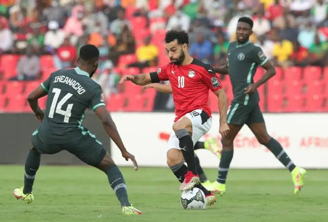 Super Eagles' forward, Iheanacho shadows Egypt's Mo Sallah during Nigeria's first match in ongoing AFCON 2021