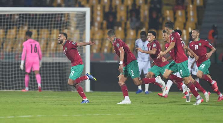 Morocco players celebrate their victory over Ghana