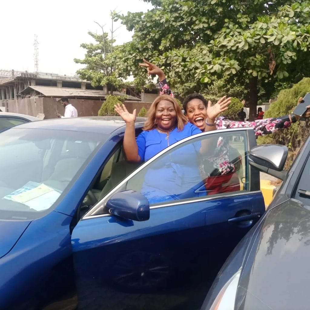 One of the staff with her car